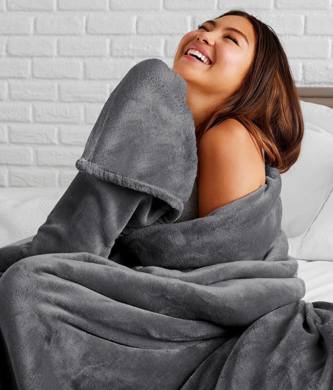 "Ultra-soft faux fur large sofa throw blanket in light grey, adding warmth and style to any living space, perfect for cozy de