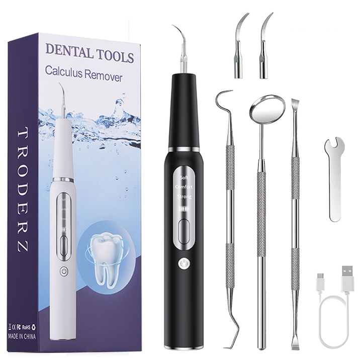 "Ultrasonic dental plaque remover with metal tips, ergonomic cordless design, USB rechargeable for effective tartar removal."