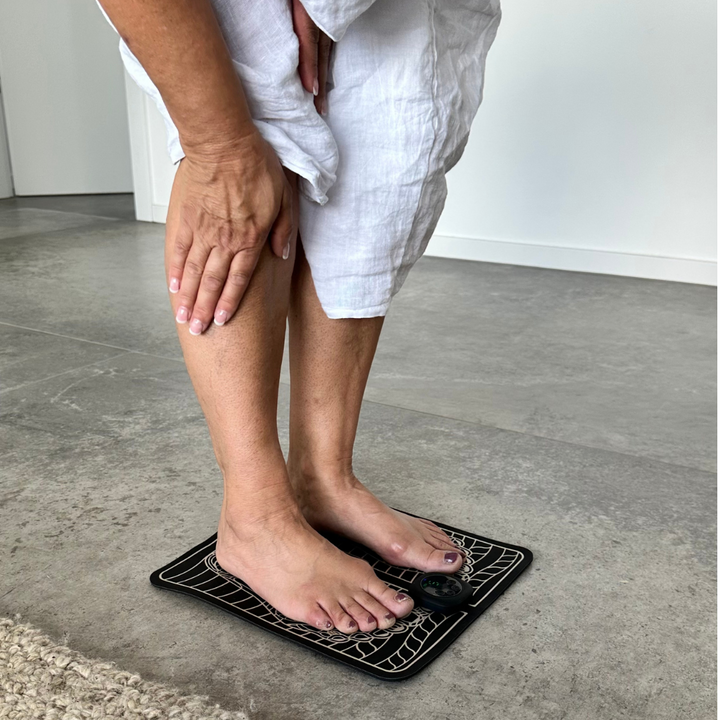 "Unisex EMS foot massager with a sleek design, showcasing six massage modes and portability for pain relief and relaxation."