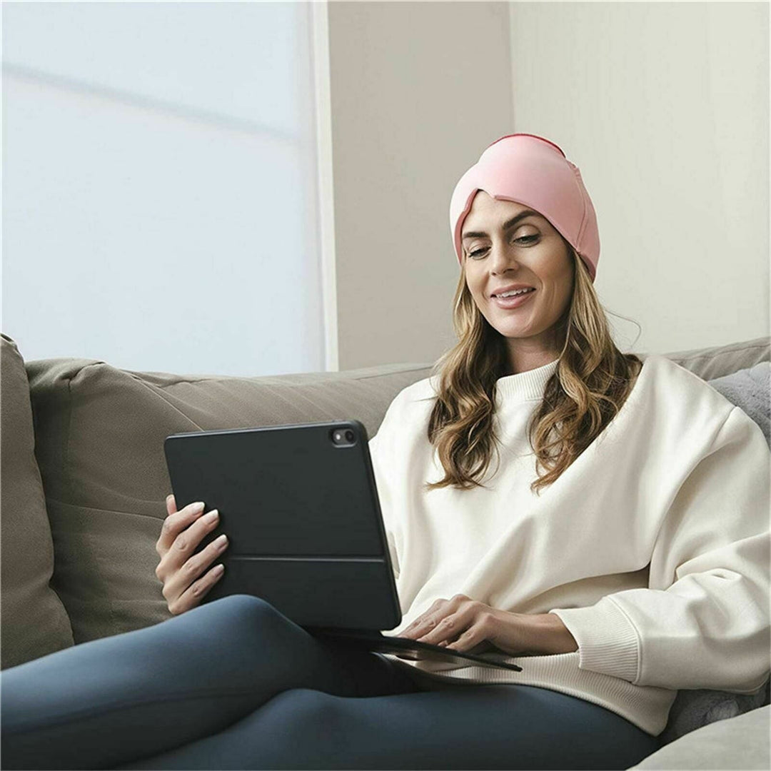 Unisex migraine relief cap in black, offers hot and cold therapy, soft fabric, covers eyes, designed for headache relief.