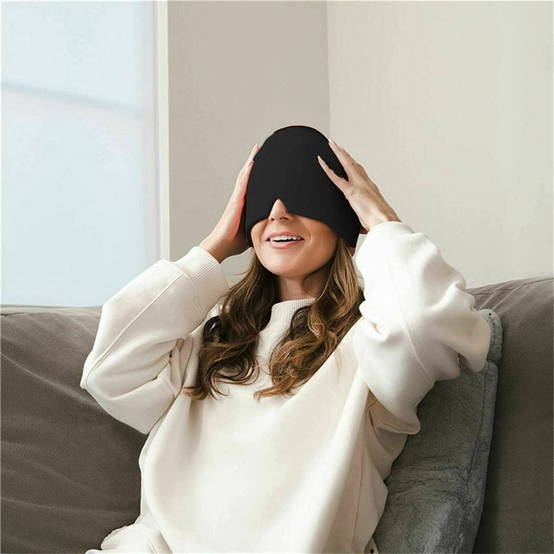 Unisex migraine relief cap in black, offers hot and cold therapy, soft fabric, covers eyes, designed for headache relief.