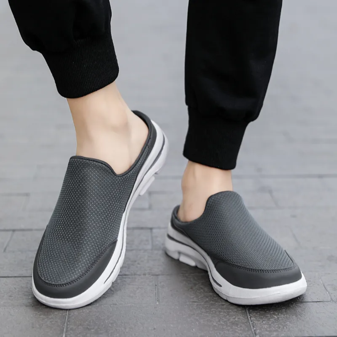 Unisex slip-on sports shoes with breathable mesh, cushioned insole, and sleek design in grey, black, blue, and brown.