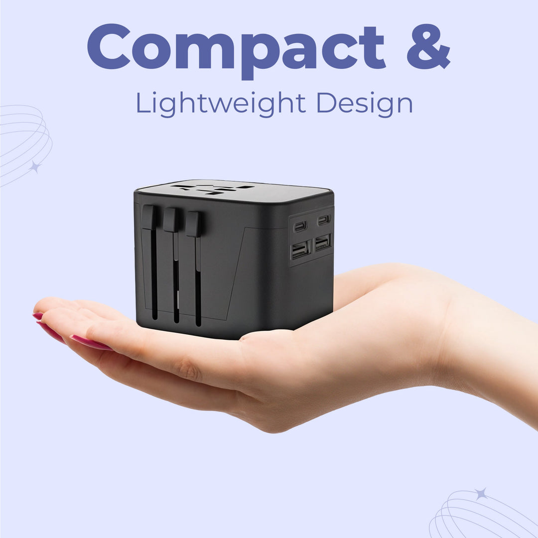 "Universal travel adapter, compact black design, with USB ports and global plug compatibility for 150+ countries."