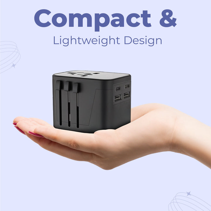 "Universal travel adapter, compact black design, with USB ports and global plug compatibility for 150+ countries."