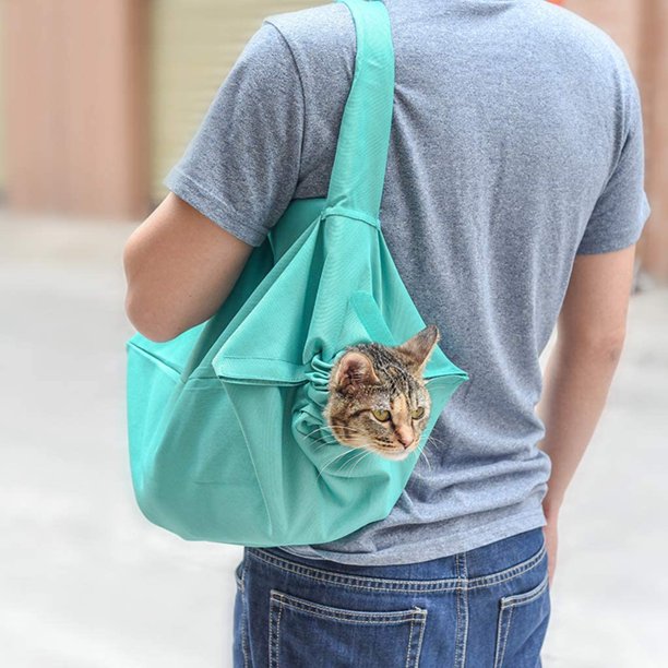 "Versatile cat carrier with shoulder strap, ergonomic design, breathable fabric, perfect for all cat breeds, easy transport."