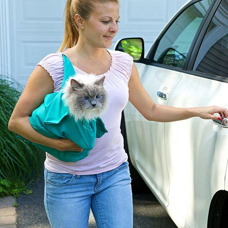 "Versatile cat carrier with shoulder strap, ergonomic design, breathable fabric, perfect for all cat breeds, easy transport."