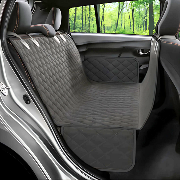 Waterproof pet car seat cover with non-slip design for dogs, providing plush comfort and protection in backseat.