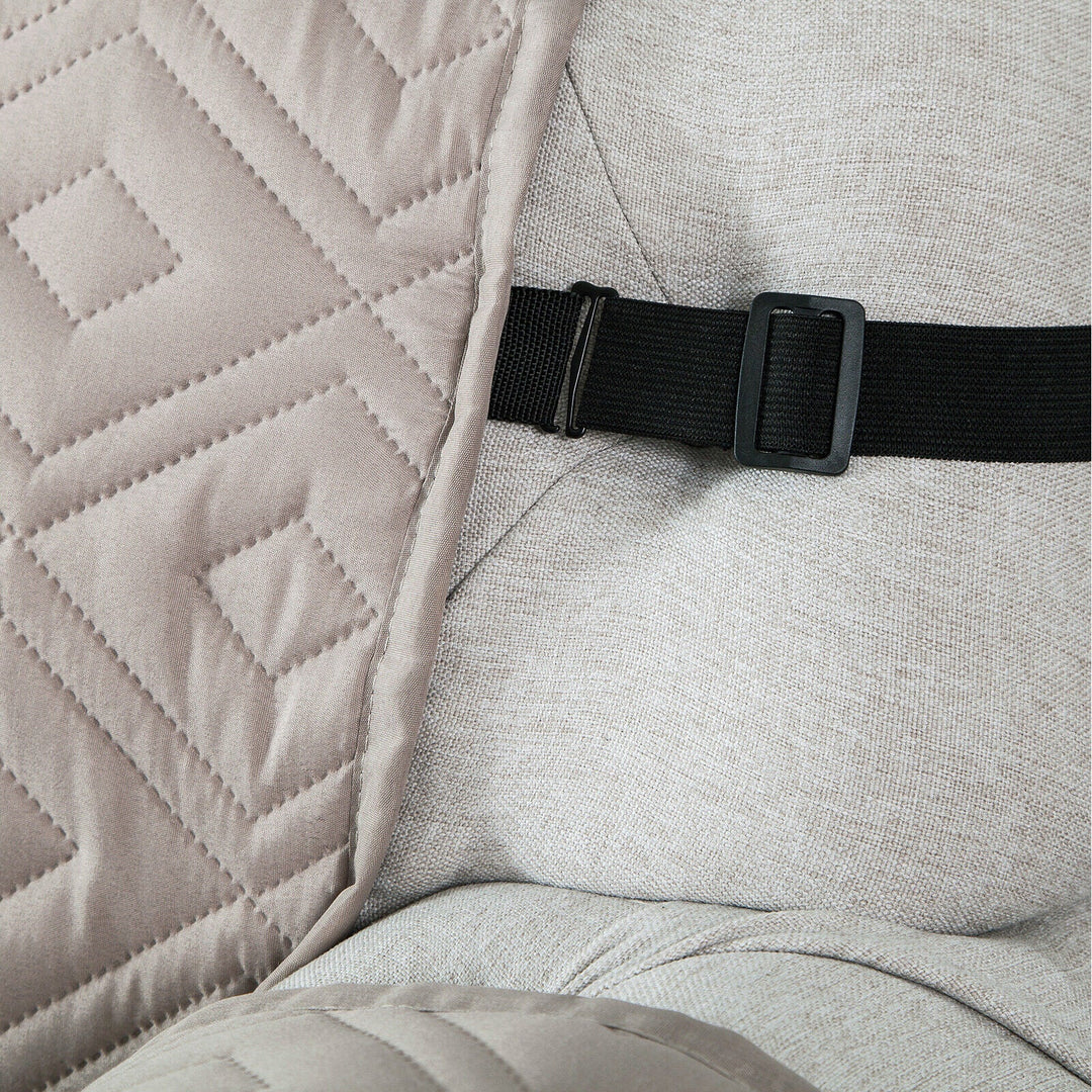 "Water-repellent non-slip reversible sofa cover protecting couch from spills and stains with pet sitting on it"