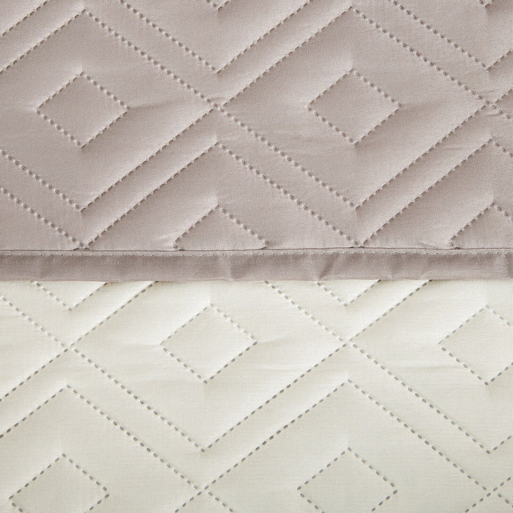 "Water-repellent non-slip reversible sofa cover protecting couch from spills and stains with pet sitting on it"