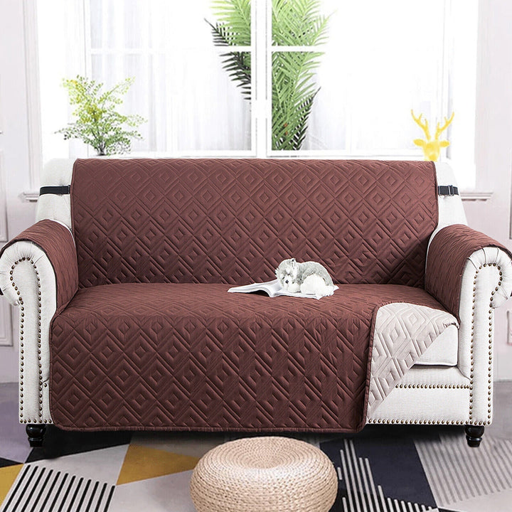 "Water-repellent non-slip reversible sofa cover protecting couch from spills and stains with pet sitting on it"