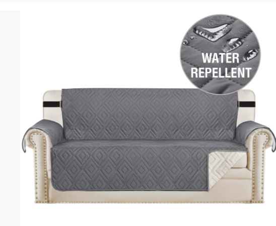 "Water-repellent non-slip reversible sofa cover protecting couch from spills and stains with pet sitting on it"
