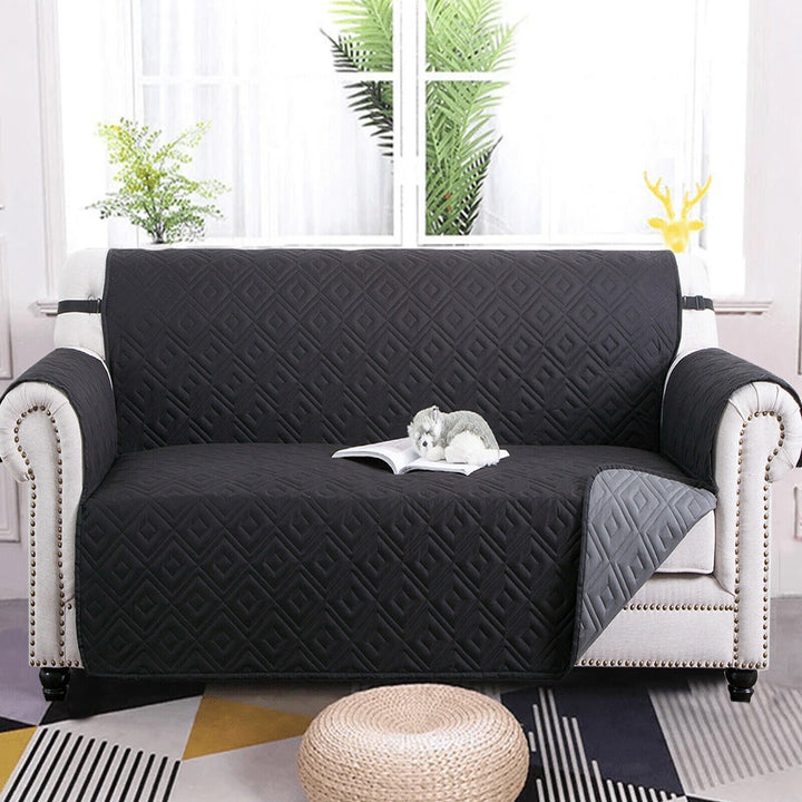 "Water-repellent non-slip reversible sofa cover protecting couch from spills and stains with pet sitting on it"