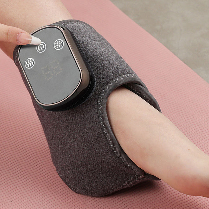 "Wireless electric foot and ankle wrap with heat, compression, and vibration for pain relief, shown in grey."