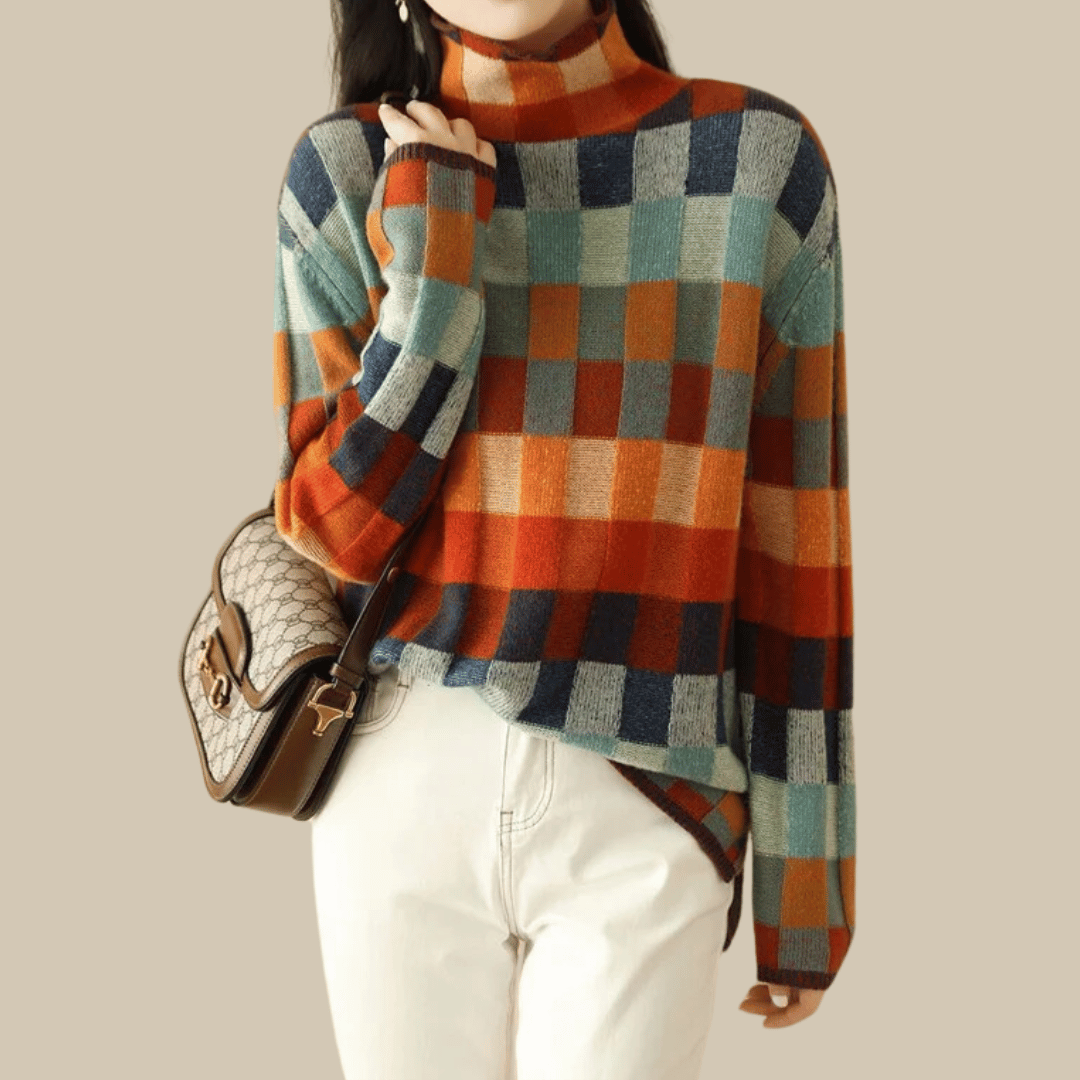 Women's cashmere patchwork turtleneck sweater in mélange hues, showcasing a unique, cozy, and stylish design for winter.