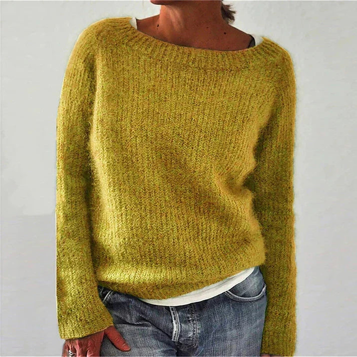 "Women's classic knitted sweater with oversized collar, ribbed details, and crew neck in a cozy, timeless design."
