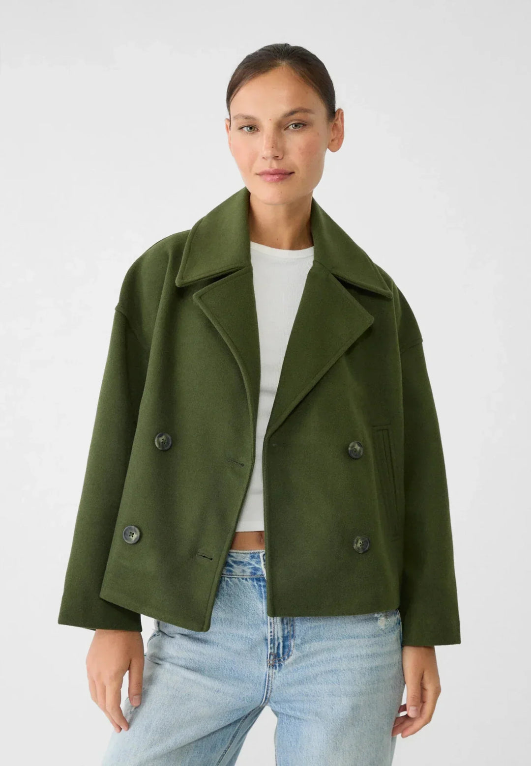 Women's double-breasted cropped jacket, front view featuring sharp lapels, structured design, and chic oversized buttons.