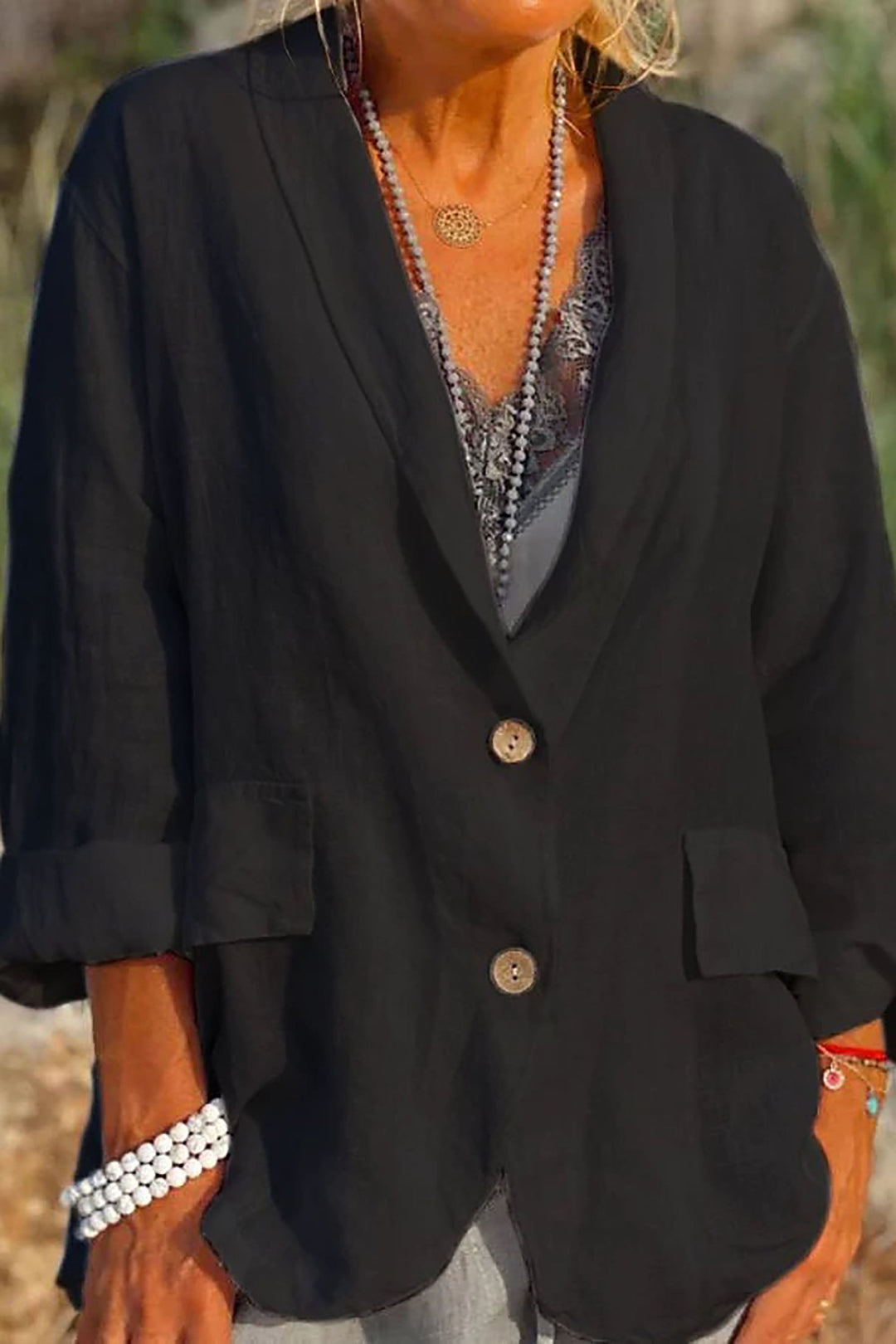 Women's light linen blazer with buttons, V-neck, and long sleeves; shown in white. Perfect for versatile, chic style.