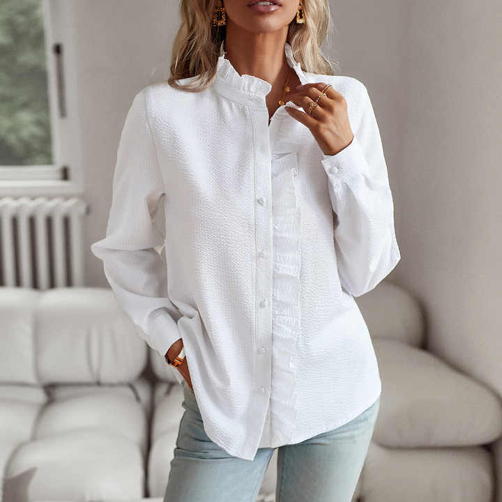 "Women's luxurious polo blouse, soft fabric with a classic button placket and tailored hem, perfect for elegant daily wear."