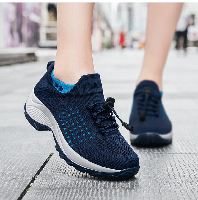 "Women's orthopaedic comfort shoes with contoured footbed, mesh upper in black and purple, providing advanced support."