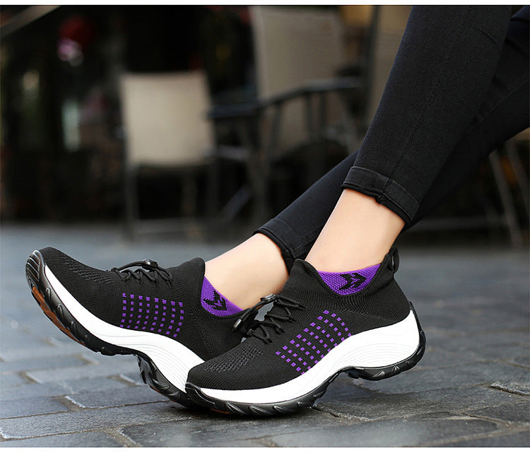 "Women's orthopaedic comfort shoes with contoured footbed, mesh upper in black and purple, providing advanced support."