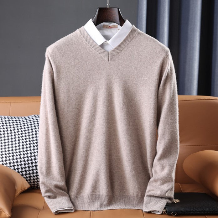 Women's premium cashmere V-neck sweater in soft pink, offering luxury and comfort with an elegant design.