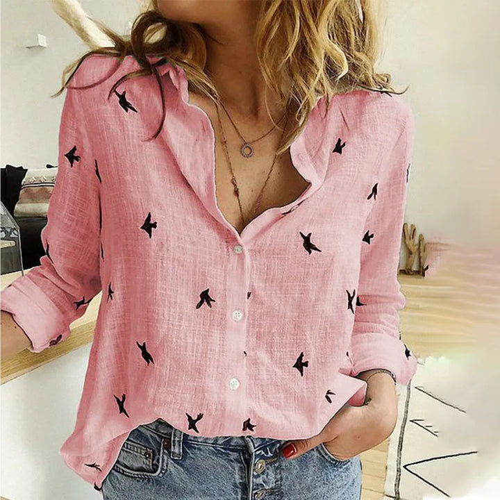 "Women's relaxed bird-print button-up blouse with colorful bird patterns, flowy silhouette, perfect for casual or office wear