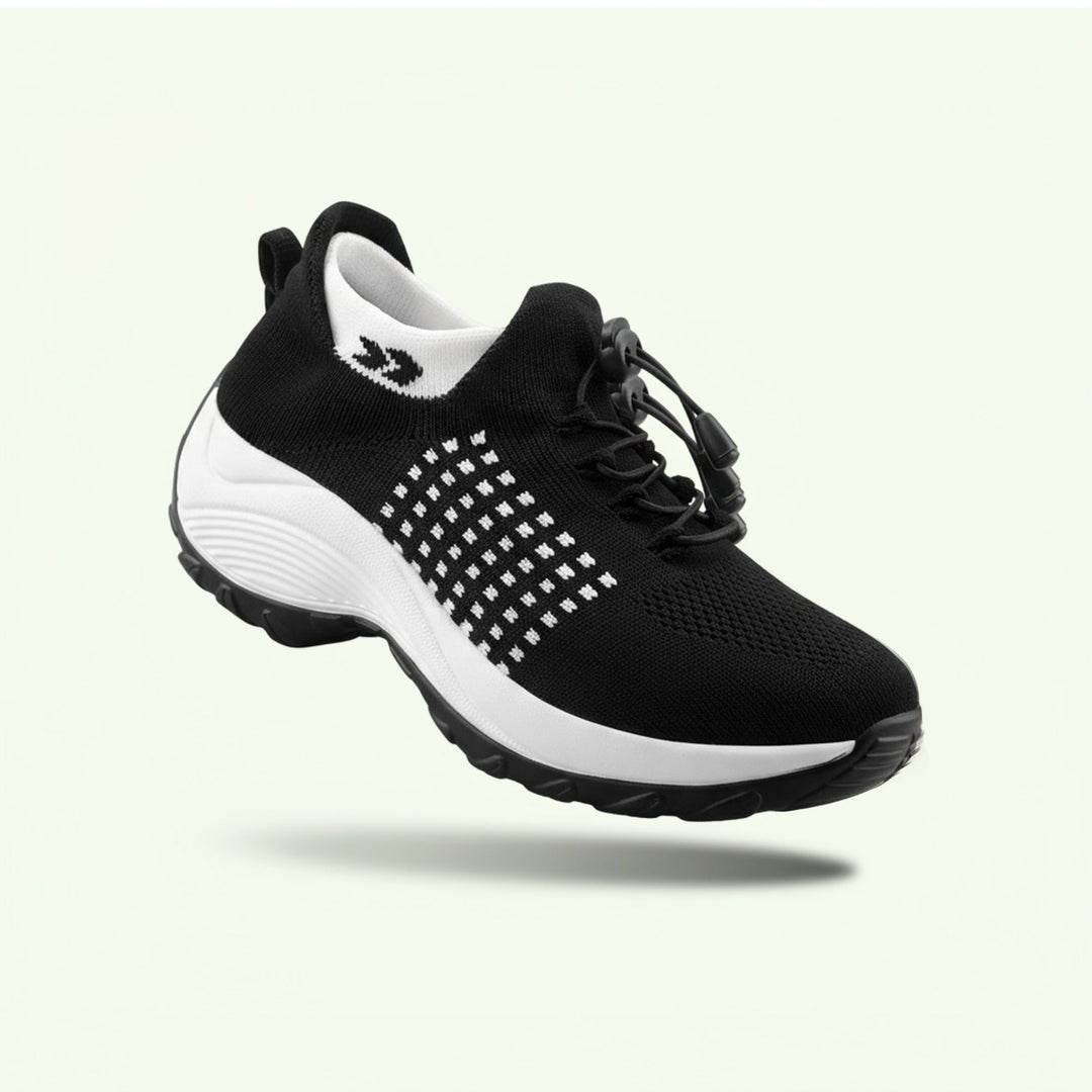"Women's stretch comfort shoes in black, featuring cushioned insoles and flexible soles for stylish everyday walking relief."