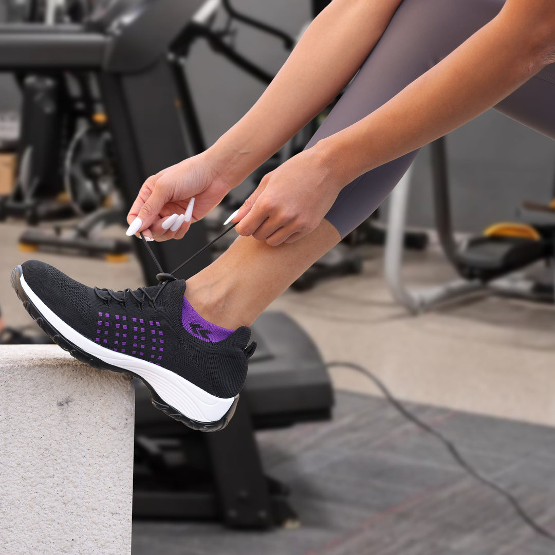 "Women's stretch comfort shoes in black, featuring cushioned insoles and flexible soles for stylish everyday walking relief."