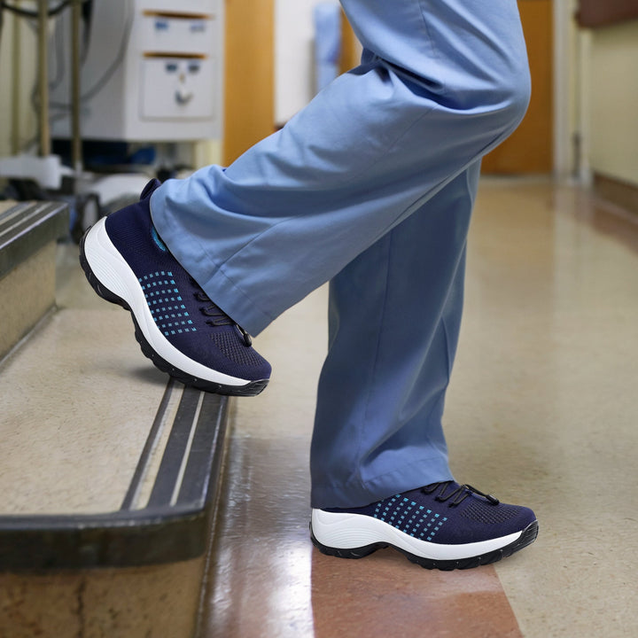 "Women's stretch comfort shoes in black, featuring cushioned insoles and flexible soles for stylish everyday walking relief."