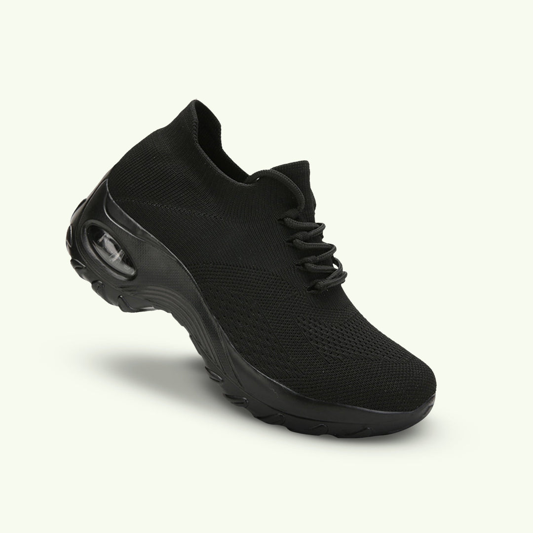 "Women's stretch comfort shoes in black, featuring cushioned insoles and flexible soles for stylish everyday walking relief."
