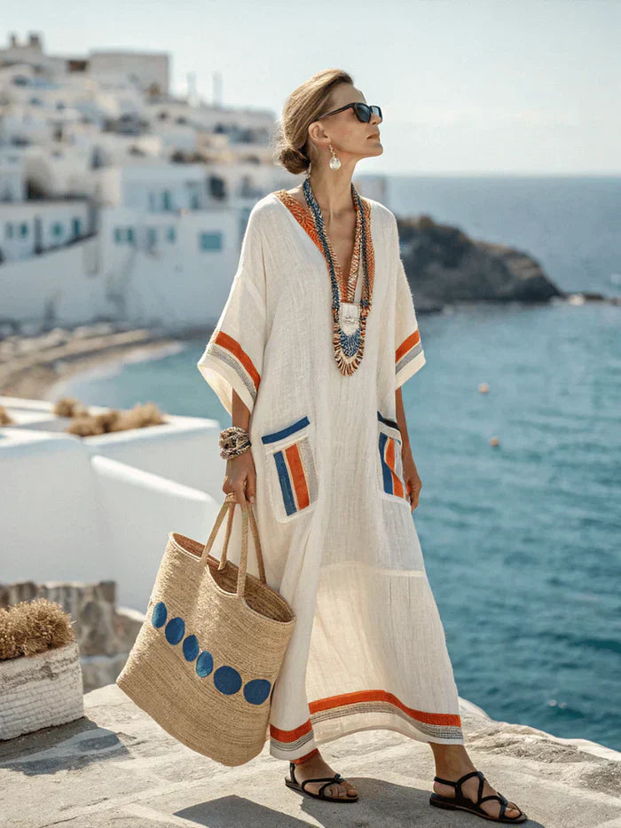 "Women's striped kaftan maxi dress, oversized fit, vibrant stripes, 3/4 sleeves, relaxed casual chic style."