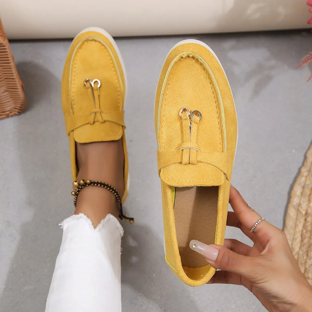 Women's suede finish loafers in white, offering comfort and style. Perfect casual shoes for elegance and ease.