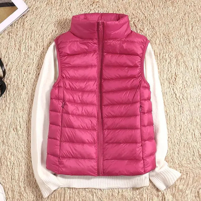 Women's ultra light down vest, stylish slim fit design, nylon material, stand collar, ideal for layering in autumn.