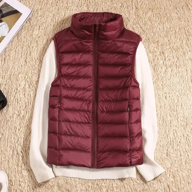Women's ultra light down vest, stylish slim fit design, nylon material, stand collar, ideal for layering in autumn.
