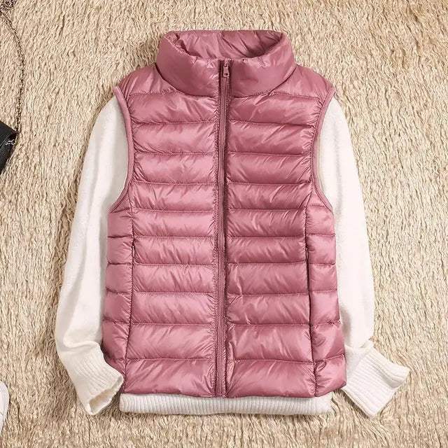Women's ultra light down vest, stylish slim fit design, nylon material, stand collar, ideal for layering in autumn.