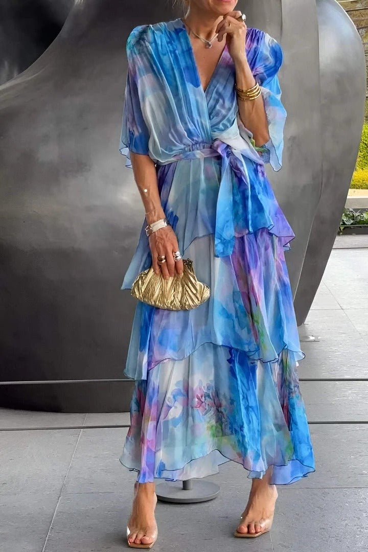 "Women's vibrant multi-colour maxi dress, flowing silhouette, side view highlighting elegant, colorful fabric design."