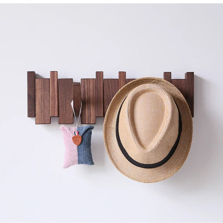 "Wooden Piano Coat Rack with 4 walnut and beech wood hooks, elegant design, ideal for home decoration and organization."