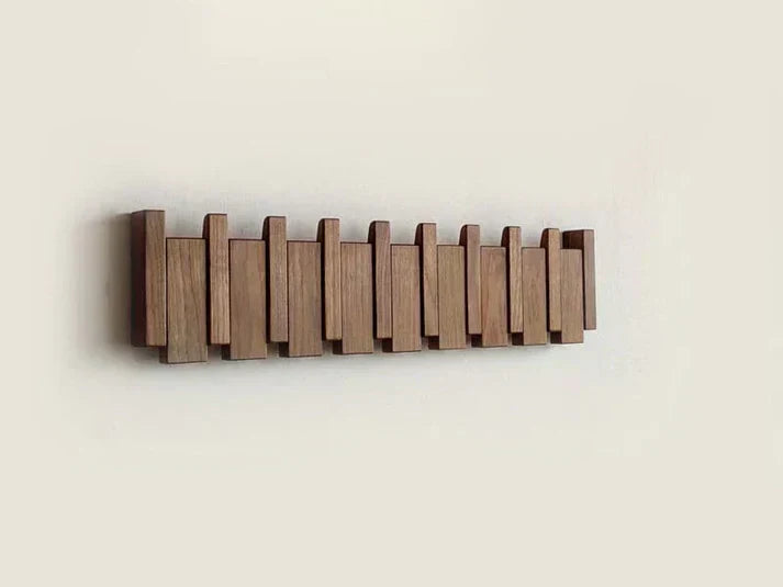 "Wooden Piano Coat Rack with 4 walnut and beech wood hooks, elegant design, ideal for home decoration and organization."