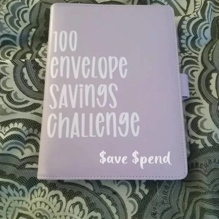 Open A5 budget planner showing interior pages, cash envelopes, and the 100 envelope challenge tracker.
