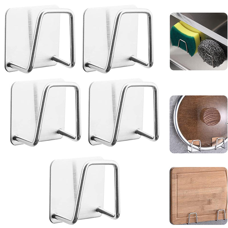Lifestyle shot of the adhesive stainless steel sponge holder in use, holding a wet sponge by the sink