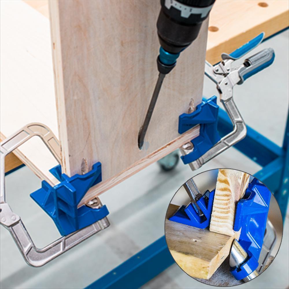 Metal corner clamp with quick-release levers, perfect for holding wood during gluing or screwing in carpentry