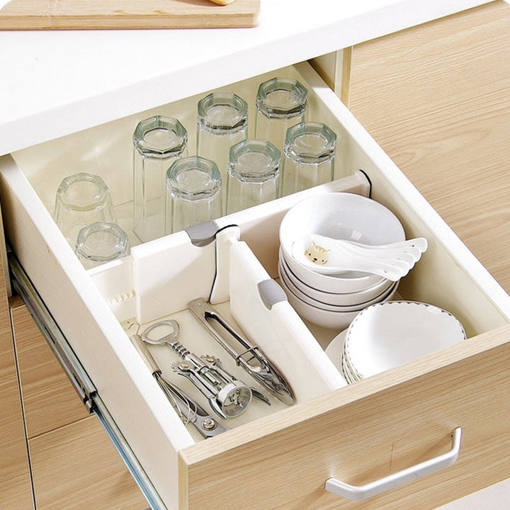 White plastic adjustable drawer dividers expanding to fit various drawer sizes for home organization