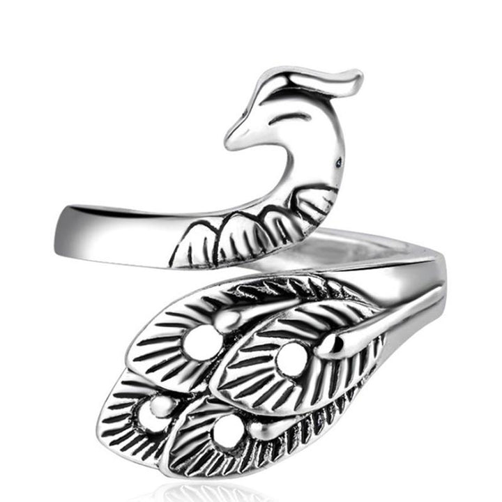 Close-up of an adjustable yarn guide ring, worn on finger, for knitting and crochet projects.