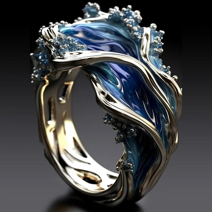 Ocean wave ring, side view, revealing adjustable mechanism and elegant wave curves