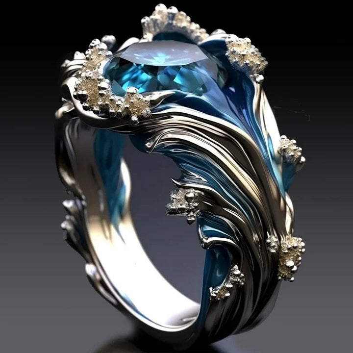 Close-up of the blue resin inlay on an adjustable silver ocean wave ring, sea-inspired accessory