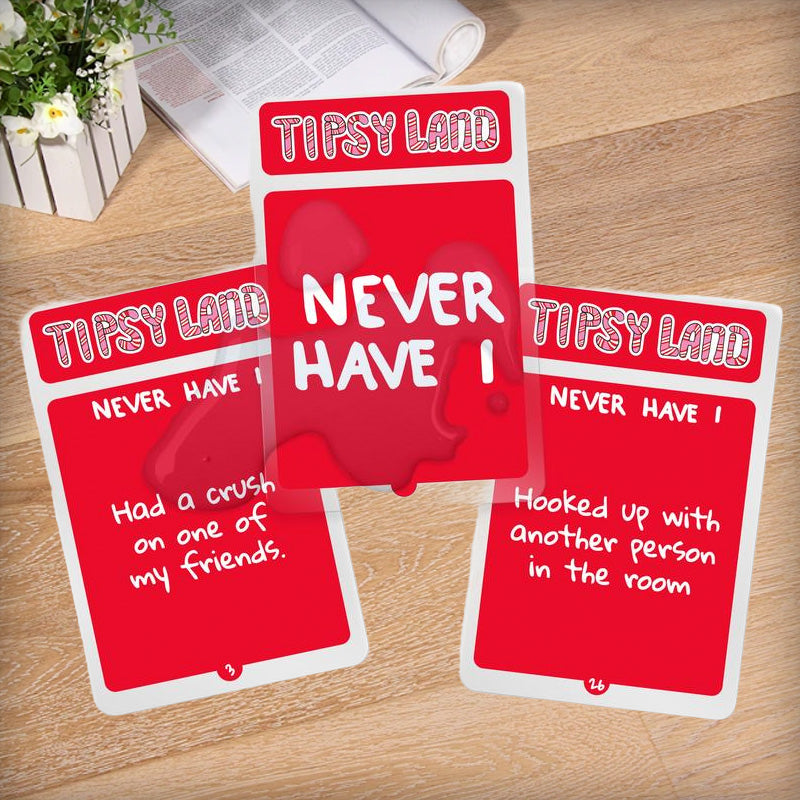 Friends cheering and holding cards from the Adult Party Drinking Game, celebrating good times.