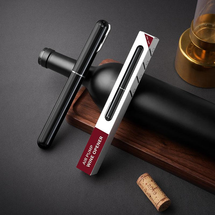 Air Pressure Wine Bottle Opener on a wooden table with corks, ready for beverage service.