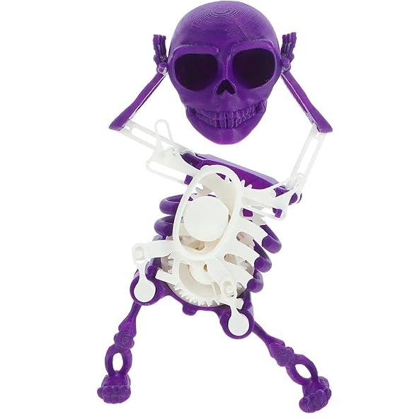 Desktop animated skull toy, small yet striking, with musical tunes and bright light effects
