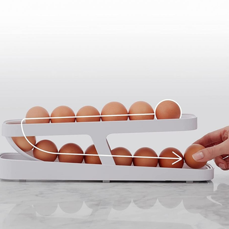 Diagram showing how the Automatic Rolling Egg Dispenser works, with eggs rolling down automatically.