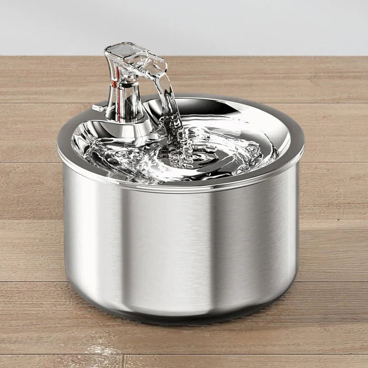 Modern automatic stainless steel cat water fountain, filtered water dispenser for continuous fresh pet hydration.